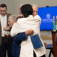 President Mantella hugging event attendee